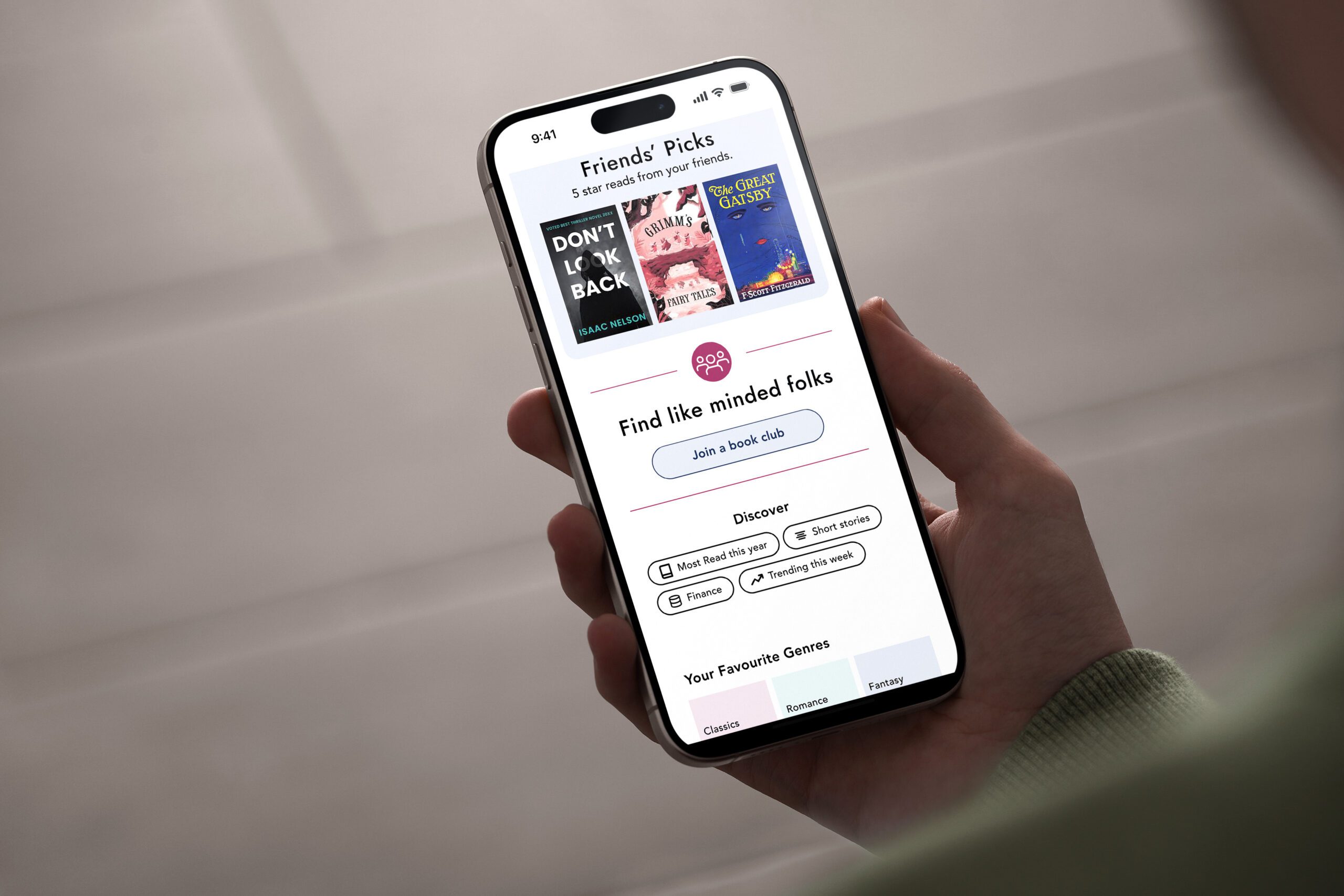 Hand holding phone with the app ShelfTalk open